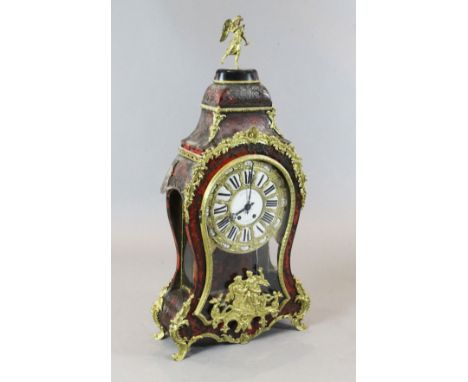 A 19th century French Louis XVI style ormolu and red boulle bracket clock, surmounted with a figure of Victory, the tablet nu