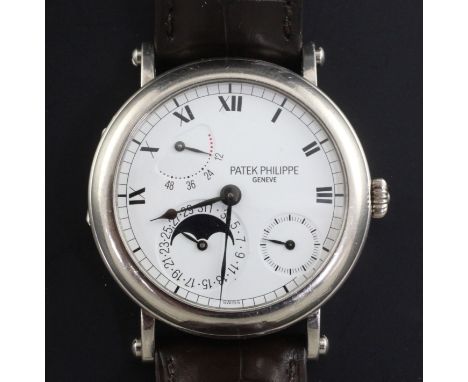 A gentleman's 18ct white gold Patek Philippe 'Officer's' wrist watch, model 5054G-001, the white enamelled dial with subsidia