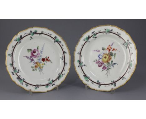 A pair of Worcester Sheridan pattern plates, c.1770, painted in the London studio of James Giles with flower sprays within vi