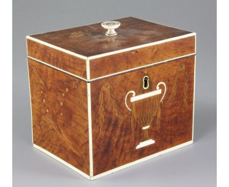 A Regency satinwood, marquetry and ivory inlaid tea caddy, decorated with an urn and containing a silver caddy spoon, width 5