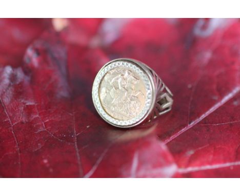 A gold half sovereign set ring dated 1982, within 9ct yellow gold mount, weight 8.4gms