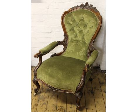 A pair of Victorian carved walnut salon chairs, with button back green upholstery, on cabriole legs; with five similar salon 