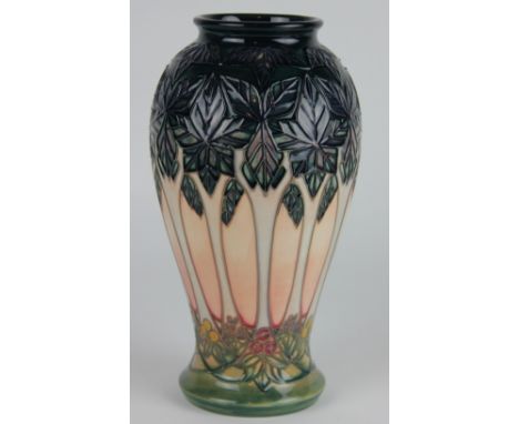 A Moorcroft Cluny pattern baluster vase c.1995, decorated with trees against a graded peach ground, impressed and painted mar