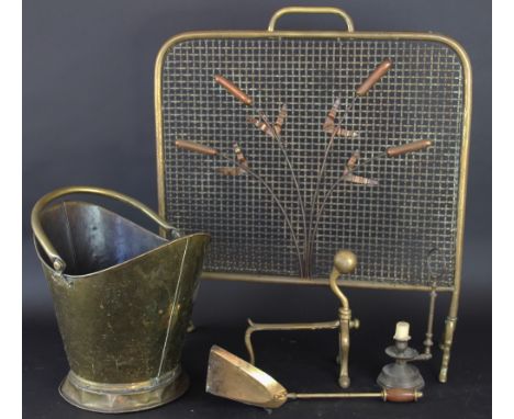 A 19th Century brass coal scuttle; a brass spark guard decorated with bull rushes; a pair of and irons; a gilt wood table lam