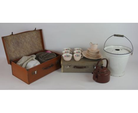 A white and blue enamel bucket and cover, a tea pot; an Aynsley part tea service; a selection of hats and two suit cases (qty