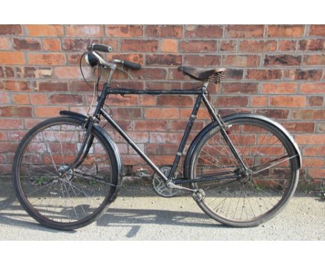 A Gentlemans Raleigh vintage bicycle, 3 speed with leather seat and front light