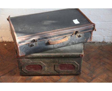 A tan leather and canvas suitcase; and a tin trunk containing a quantity of books (qty)