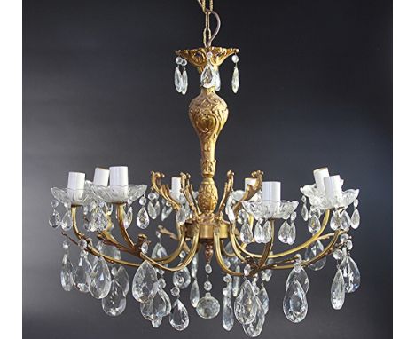 A Continental gilt brass eight light chandelier, with cut glass lustre drops, 64cm