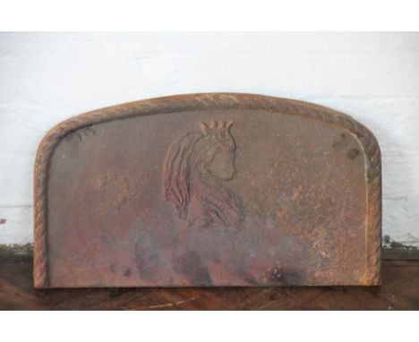 A small Victorian cast iron fireback, decorated with a profile portrait of Queen Victoria