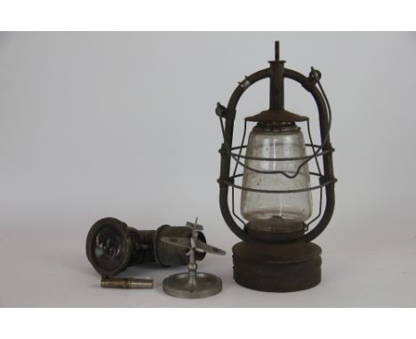 A metal Spitfire ashtray; a The Revenge bicycle lamp; a paraffin lamp and necessaire and an assortment of fish eye glass beer