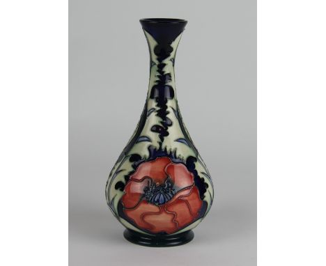 A Moorcroft Poppy pattern vase, c. 1996, the tapering ovoid vase decorated with red blooms against a cobalt ground, impressed