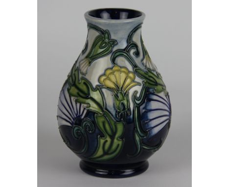 A Moorcroft Hawksbeard pattern vase c. 1993, the ovoid vase decorated with yellow and white blooms and green scrolling foliag