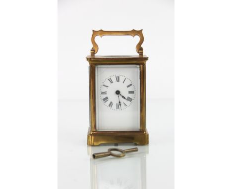 A French brass carriage time piece, with enamel Roman numeral dial, 12cm H