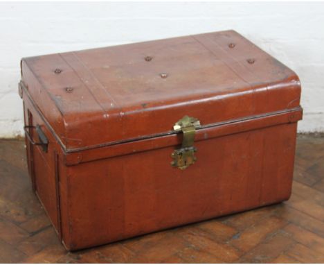 A vintage tin travelling trunk, with brass lock and cover (no key), 42cm H x 69cm W x 46cm D