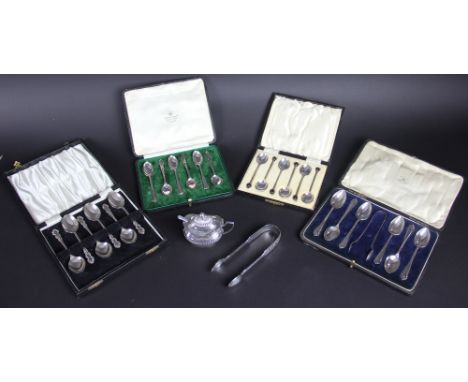 A cased set of silver tea spoons and sugar nips, three further cased sets of six silver teaspoons, a pair of silver sugar nip