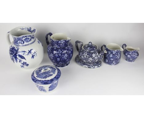 A collection of Burleigh Calico pattern wares to include; a large jug 20.5cm high, a jug 12cm high, a teapot and cover 14.5cm