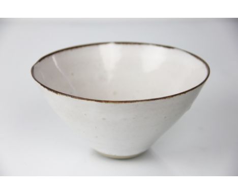 Dame Lucie Rie D.B.E (1902-1995) a stoneware bowl, glazed throughout in pale grey/white, the rim with a thin manganese line, 