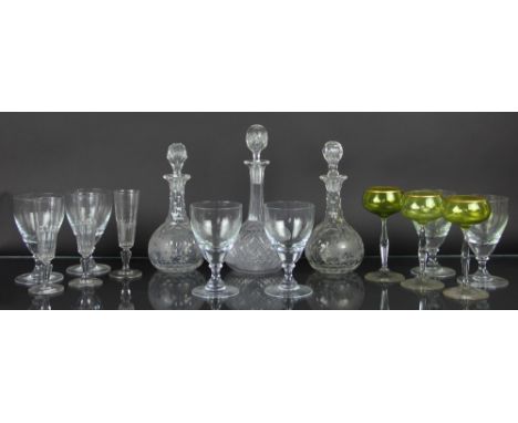 A pair of late 19th Century faceted glass decanters, decorated with vine leaves, none matching stoppers; a 19th Century cut g