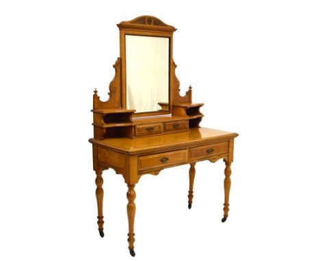 Edwardian ash dressing table, the raised back fitted swing mirror, two trinket drawers flanked by open shelves, two drawers t