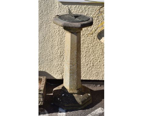 Reconstituted stone garden sundial and pedestal, the circular metal plate on octagonal top, stem and base, 92cm high   Condit