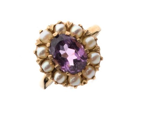 9ct gold ring set central oval amethyst-coloured stone with seed pearl border, size N, 4.4g approx   Condition: 