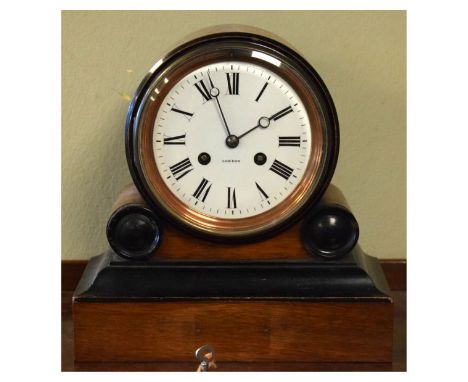 Victorian walnut and ebonised drum shaped mantel clock, the white enamel dial with Roman numerals, French brass movement stri