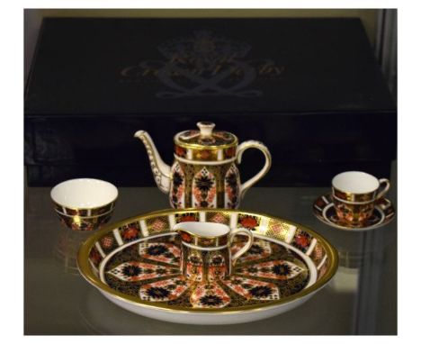 Modern Royal Crown Derby miniature tea set comprising: teapot, cream jug, sugar basin, cup and saucer and tray   Condition: 