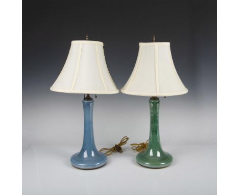 Two beautiful hand-blown art glass lamp bases. The glass showcases a captivating, mottled iridescence, with one base featurin