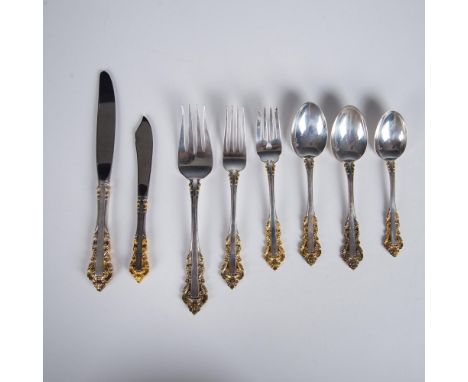 Beautiful silver with gold ornament in the Golden Medici pattern. Includes: One dinner fork, one dinner knife with stainless 