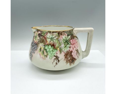 Hand painted wash pitcher adorned with cluster of grapes and a gilded band on the rim. Artist signed. B &amp; Co. Limoges Fra