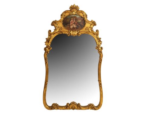 This handsome original Rococo style mantle/hall mirror is made with elaborate carved gilt wood reminiscent of 18th century in