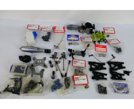 Kyosho - An unboxed Kyosho GZ nitro engine with a quantity of loose parts and some parts in sealed packaging. Lot includes Ky