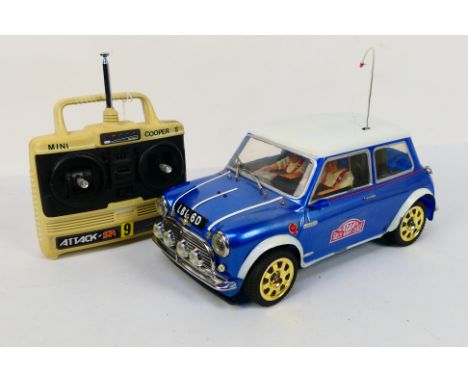 Tamiya - An unmarked and attributed to Tamiya, 1:10 electric RC Racing Car 'Rover Mini Cooper Monte Carlo Rallye' chassis wit