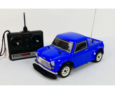 Kyosho - Tamiya - An unboxed Kyosho 1:10 scale electric RC with Tamiya Mini Pick-Up body shell. The model bears an internal s