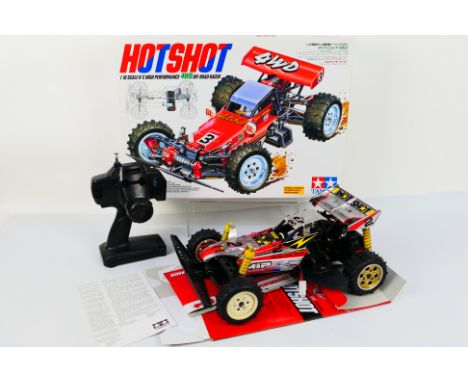 Tamiya - A boxed Tamiya #58391 1:10 scale nitro RC High Performance 4WD Off Road Racer 'Hotshot'. The model is constructed an