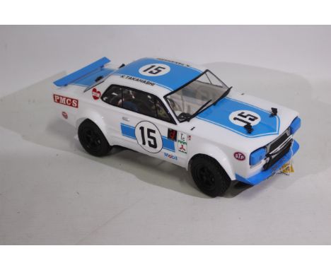 Kyosho - An unboxed Kyosho 1:10 scale electric RC Skyline 2000 GT-R Racing. The electric chassis appears to be in Mint condit