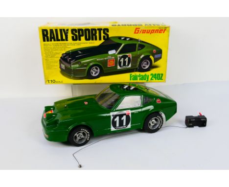 Graupner  / Kyosho - A boxed Graupner / Kyosho #4969 1:10 scale nitro RC 'Rally Sports' Fairlady 240Z. The model is construct