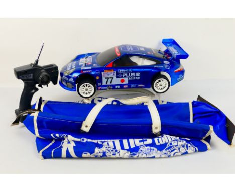 Kyosho - An unboxed Kyosho 1:10 scale nitro RC PureTen Alpha Porsche 911 GT3. The model appears to be in Mint condition and g