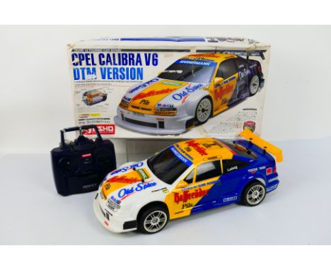 Kyosho - A boxed and constructed Kyosho #30513 1:10 scale nitro RC Opel Calibra V6 DTM Version. The model shows signs of use 