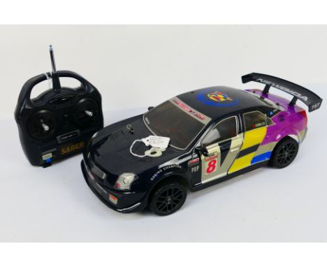 Kyosho - An unboxed Kyosho 1:10 scale nitro RC Mantis GPFF rear wheel drive with Cadillac CTS body shell. The model is somewh