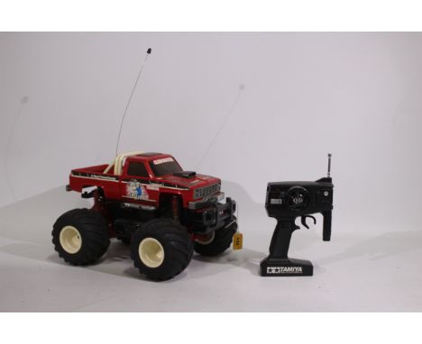 Tamiya - An unboxed vintage Tamiya 1:14 electric RC 'Clod Buster' Monster Truck. The truck shows signs of age with some fadin