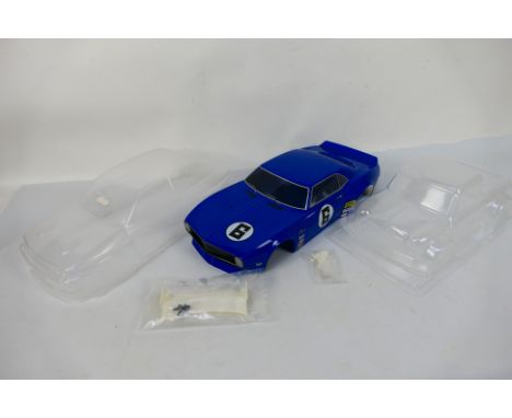 Tamiya - Kyosho - Three unboxed and unbranded RC body shells probably in 1:10 scale. Lot consists of a Chevrolet Camaro in bl