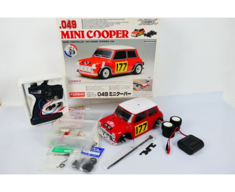 Kyosho - A boxed Kyosho #16800 1:10 scale nitro RC .049 Mini Cooper. The model is constructed with wheels detached, and comes