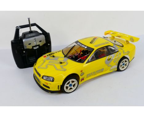 Kyosho - An unboxed Kyosho 1:10 scale nitro RC MSpider Nissan Skyline GTR. The model is somewhat exhibits some signs of use a