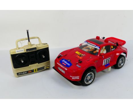 Tamiya - An unboxed Tamiya 1:10 electric RC Porsche 911 Rally Car. The chassis shows a few signs of use appearing Very Good -