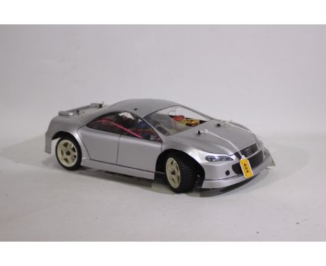 Kyosho - An unboxed Kyosho 1:10 scale nitro Mantis GPFF 2 speed chassis fitted with a 'Mazda' style silver bodyshell. The mod