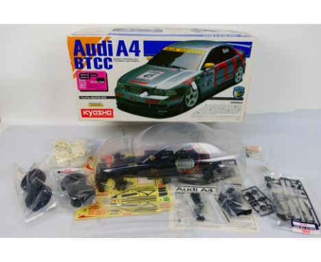 Kyosho - A boxed Kyosho #30605 1:10 scale RC Audi A4 BTCC EP version kit. The model is part assembled and comes with body she