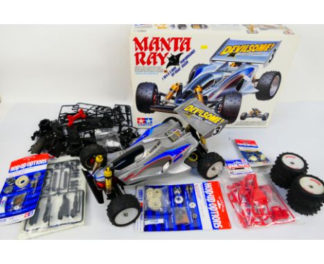 Tamiya - A boxed Tamiya #58087 1:10 scale RC High Performance Off Road Racer 'Manta Ray'. The electric model show signs of us