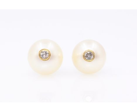 Pair of pearl gold stud ear-rings each set with a single diamond, hallmarked 18ct Condition Report Click here for further ima