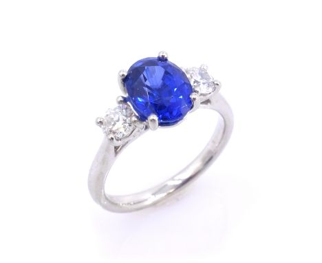 Platinum sapphire and diamond three stone ring, oval sapphire approx 2.7 carat, diamonds approx 0.5 carat   Condition Report 